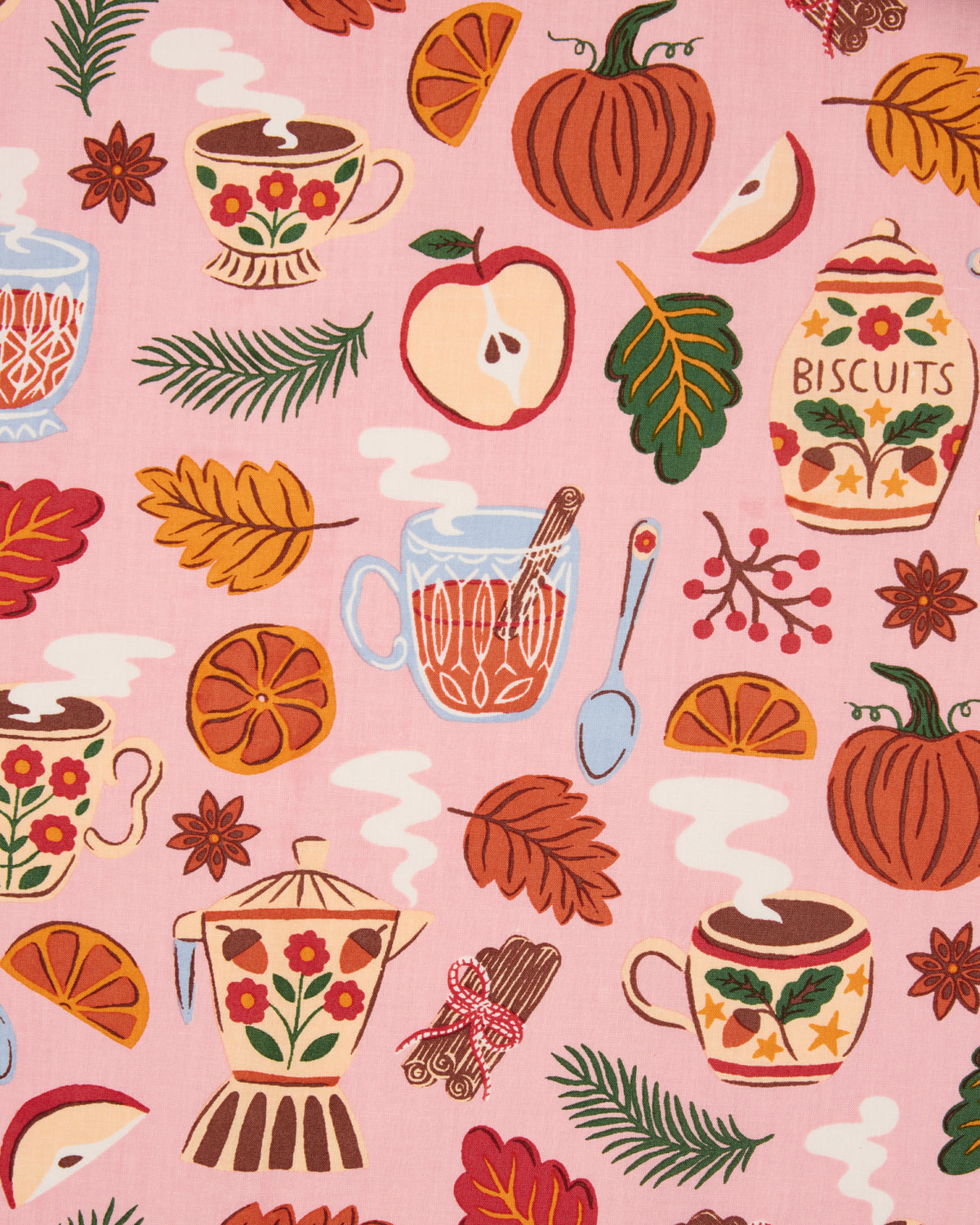 Autumn Cafe print swatch showing pumpkins, apples, citrus, leaves, teacups, teapots, and biscuit jars on a pink background.