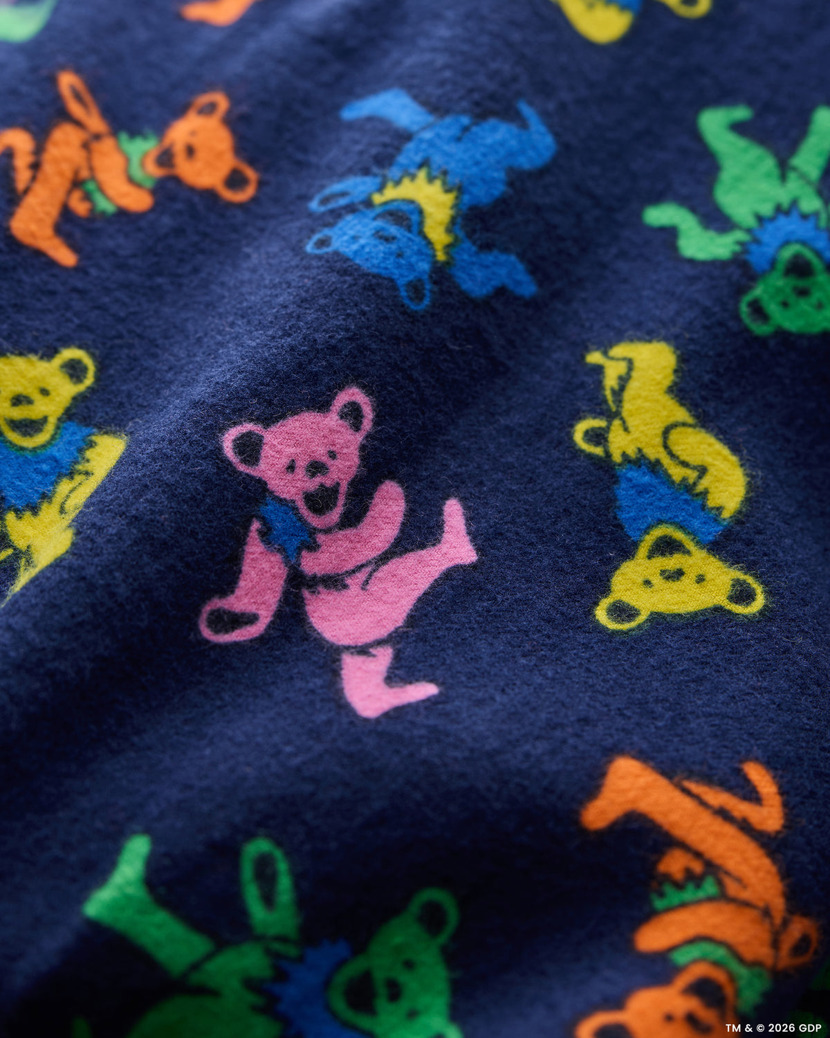 Close-up of the multicolored Dancing Bears print on the Backstage Blue flannel pajama fabric.