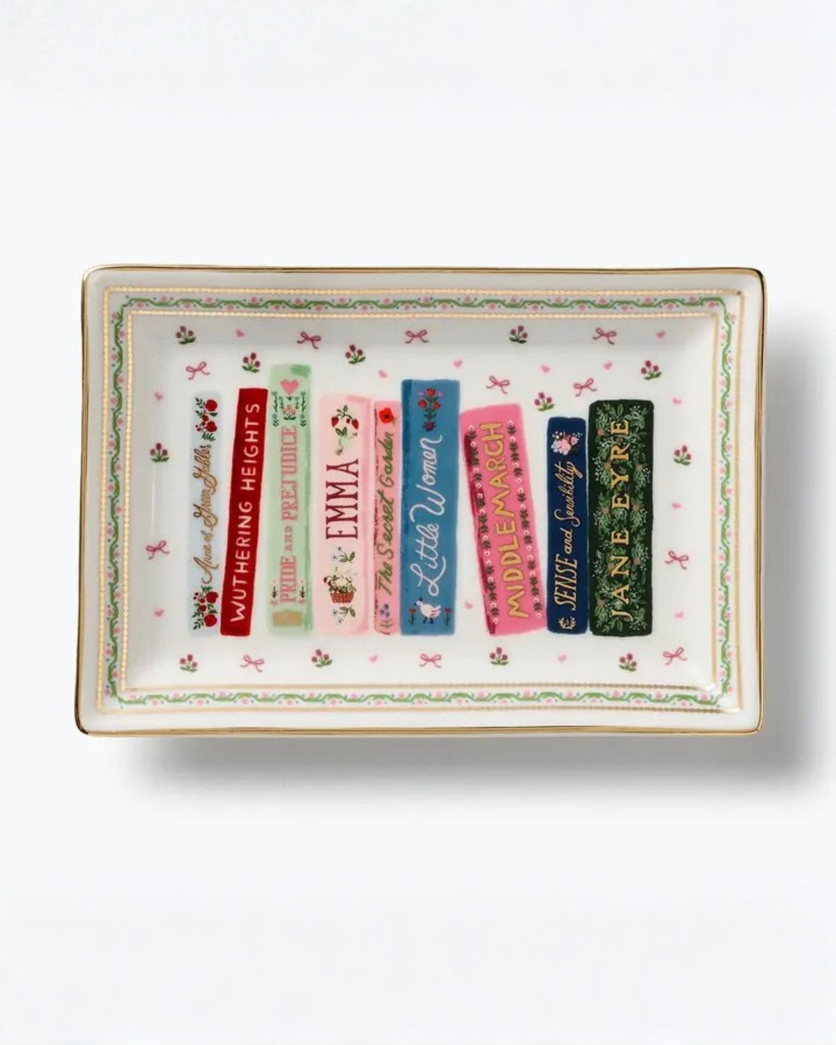 Rectangular porcelain catchall tray with a floral border and illustrated book spines, including Wuthering Heights, Pride and Prejudice, Emma, Little Women, Middlemarch, Sense and Sensibility, and Jane Eyre.