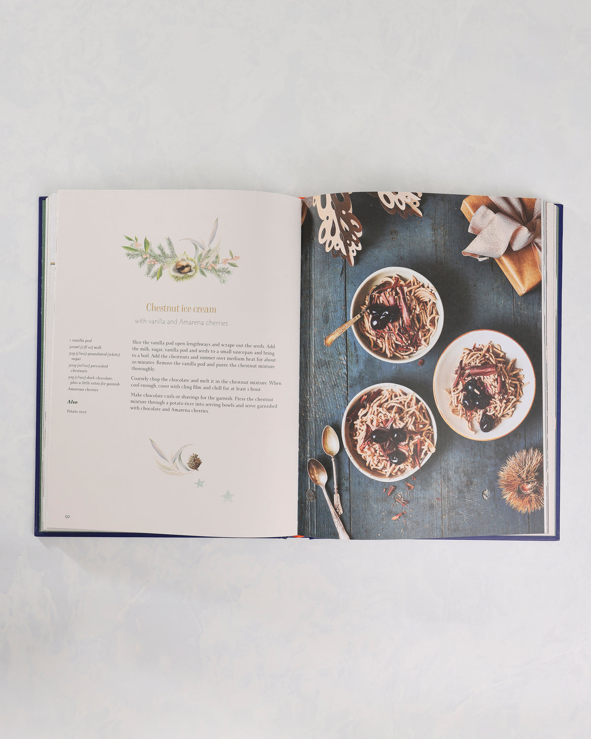 Open cookbook showing the “Chestnut ice cream” recipe beside a photograph of three bowls of dessert.