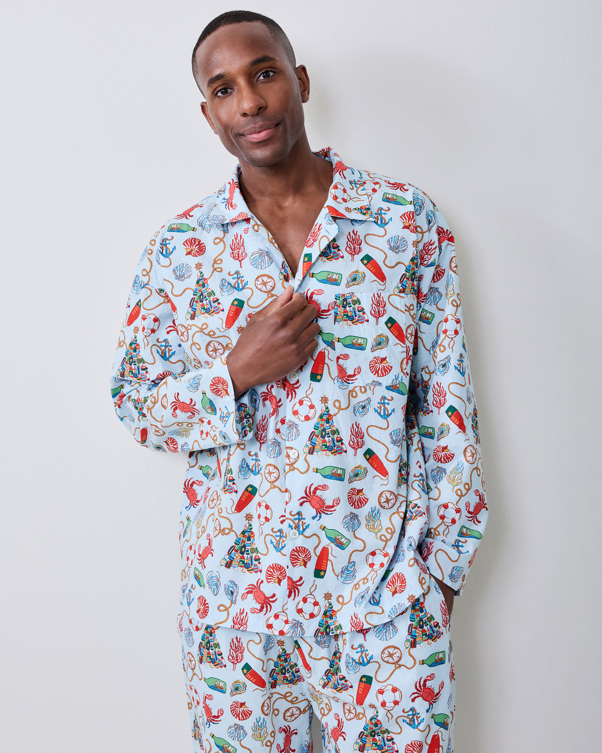 Front view of the men's Holidays Ahoy long pajama set with a light blue nautical holiday print.
