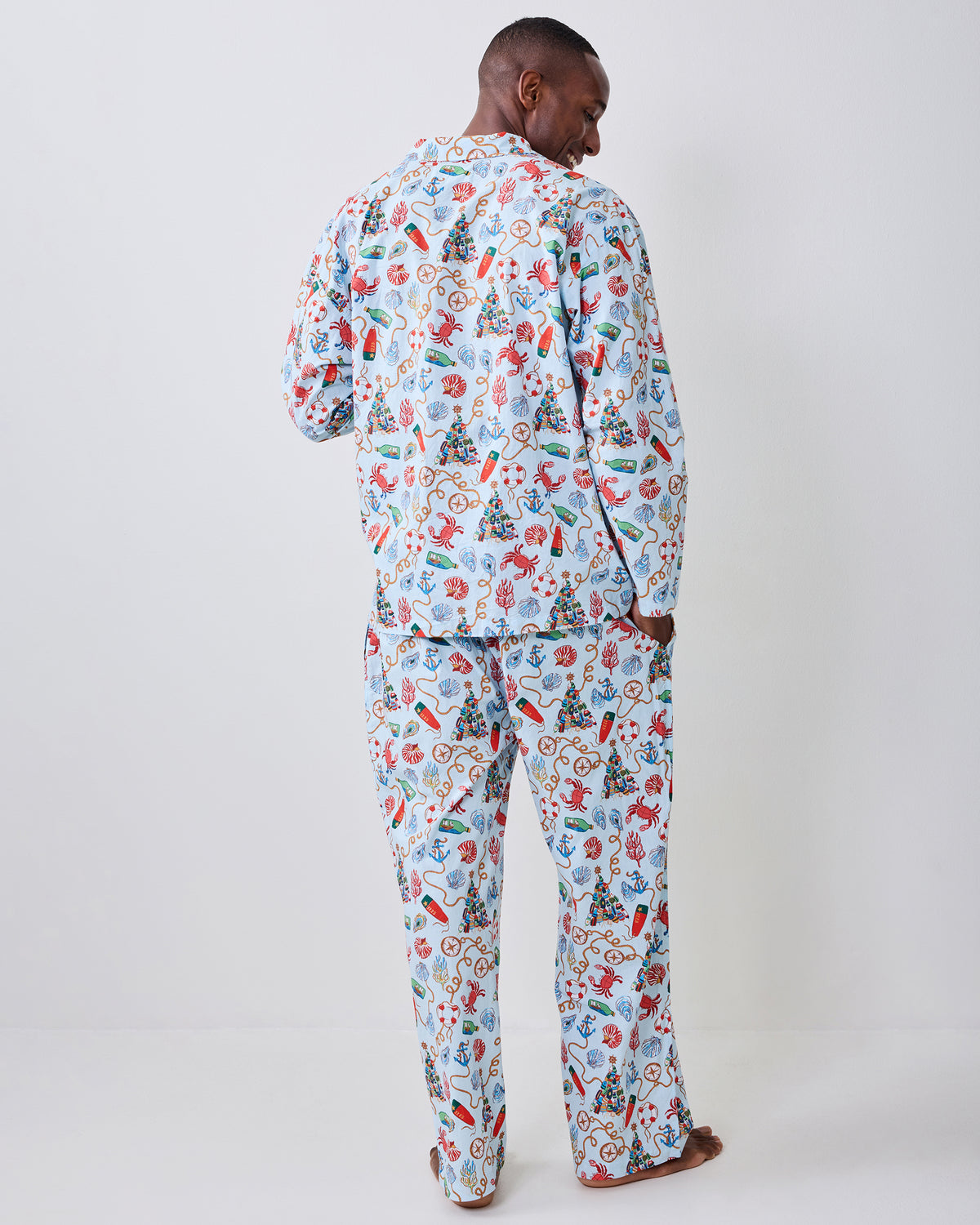 Back view of the Holidays Ahoy long pajama set with a blue-and-white nautical Christmas print.