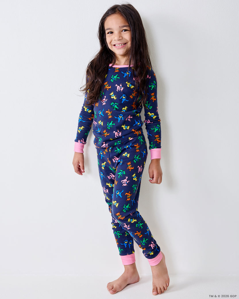 Child modeling the Dancing Bears kids pajama set in a standing pose.