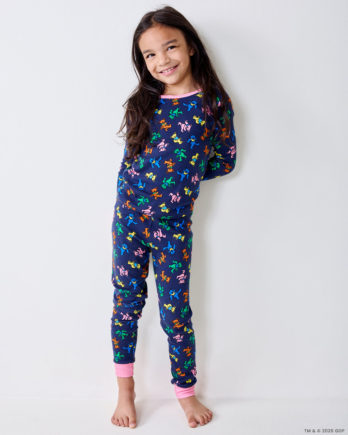 Child wearing the Dancing Bears kids pajama set, shown in a three-quarter pose.
