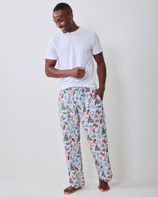 Full front view of the men's long pajama pants with a light blue nautical holiday print.