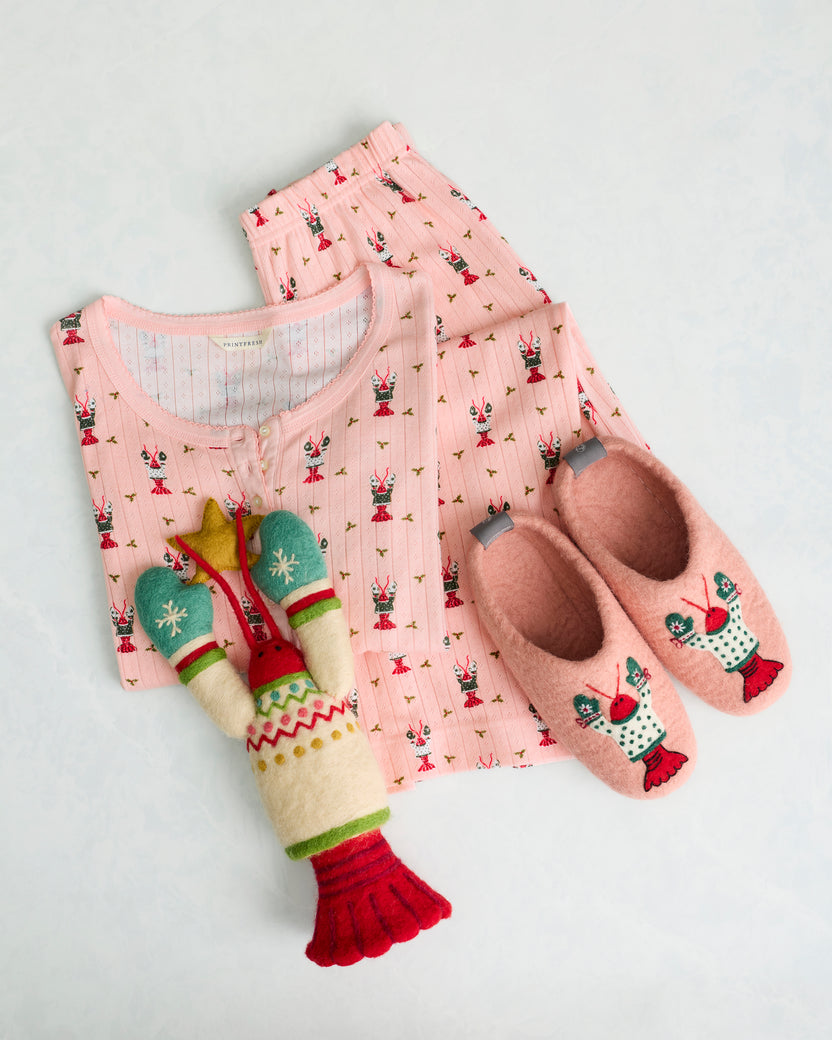 Felt lobster tree topper displayed with pink printed pajamas and matching embroidered slippers.