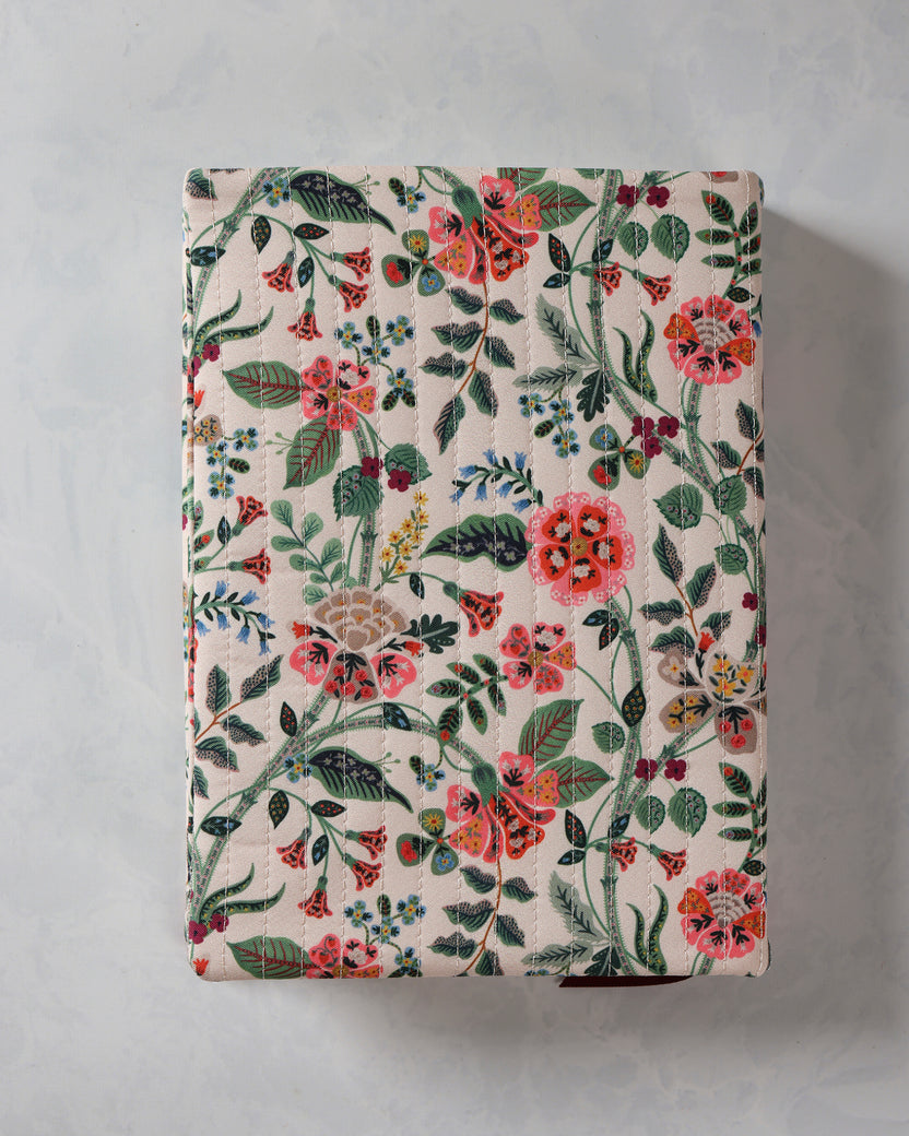 Closed Gracie quilted journal with a multicolor floral cover pattern.