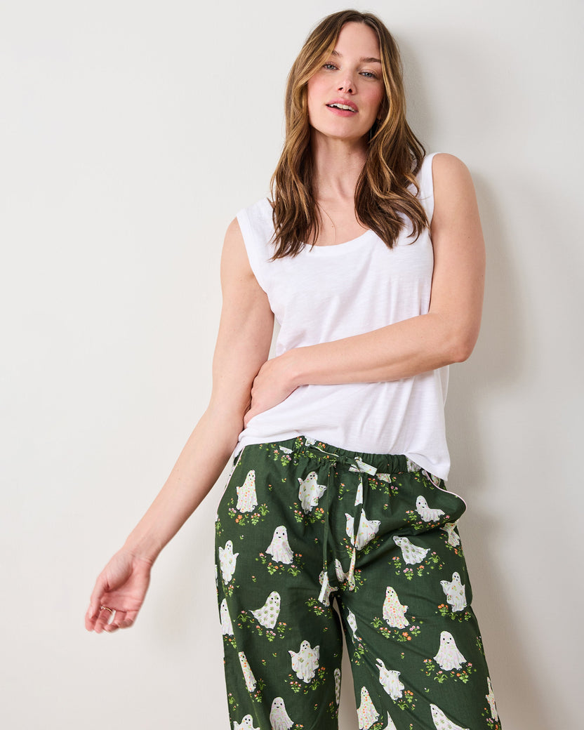 Front view of Gardening Ghosts pajama pants with an elastic drawstring waistband, pockets, and ghost-and-flower print.
