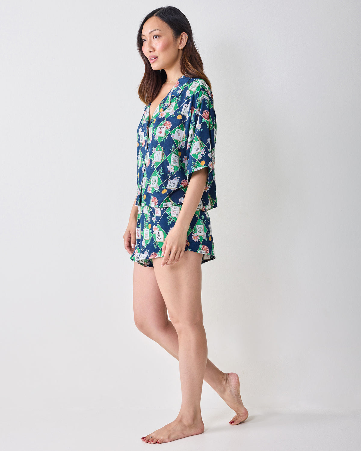 Full-length side view of a person wearing the Mahj Garden Sweet Dreams set with a patterned short-sleeve top and matching shorts.