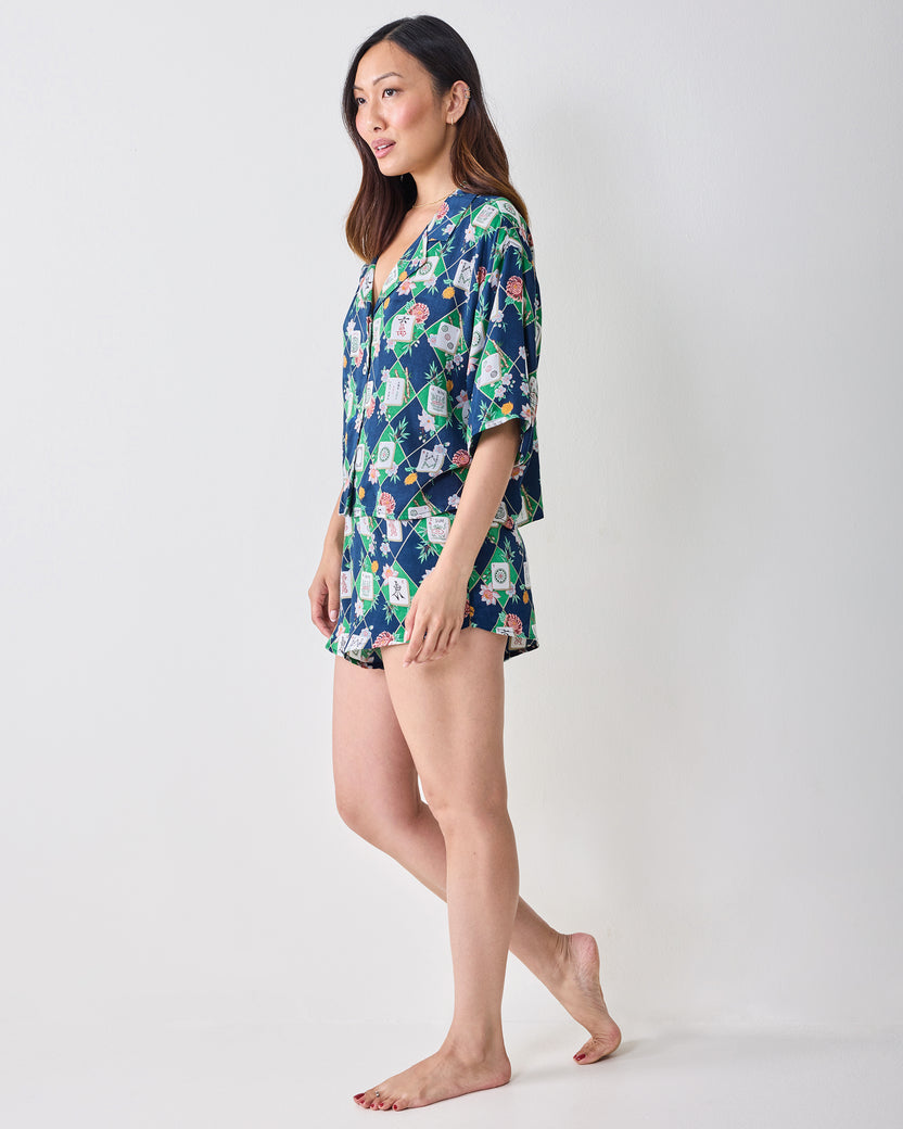 Full-length side view of a person wearing the Mahj Garden Sweet Dreams set with a patterned short-sleeve top and matching shorts.