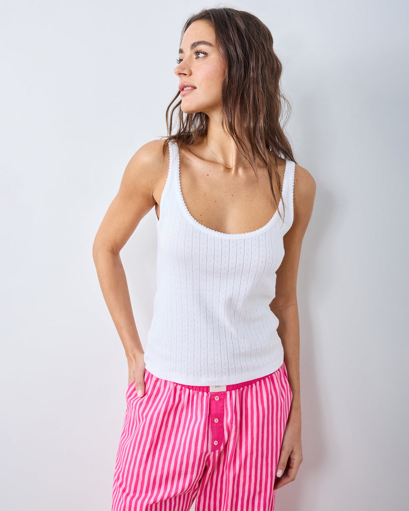 Front view of the white Esme tank top with wide straps, a scoop neckline, and vertical pointelle detailing.