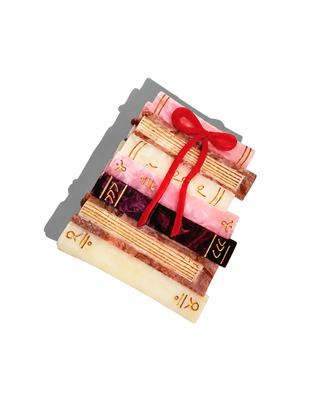 Multicolored claw hair clip shaped like a stack of books with a red bow and gold line details.