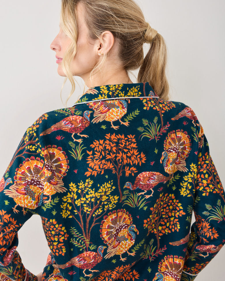 Close back view of the Turkey Trot navy pajama top, showing its collar, piping, and autumn turkey and foliage print.