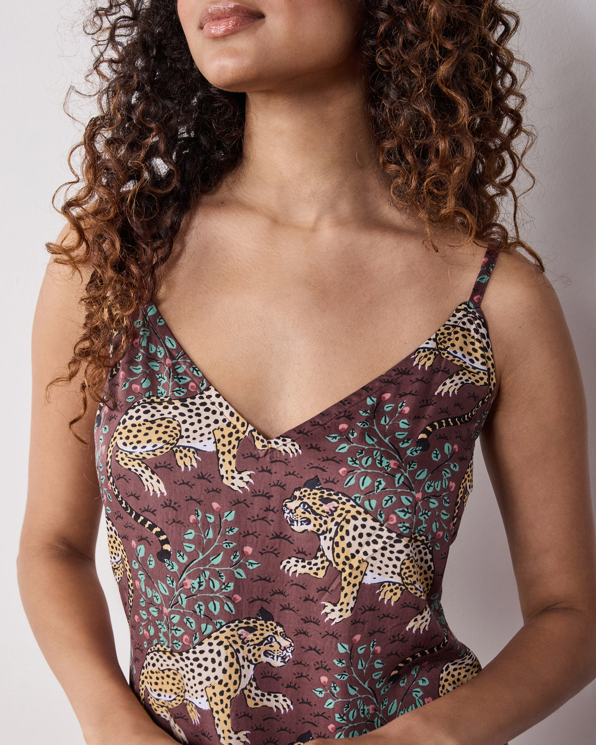 Close-up of the Bagheera Eco Satin Nightgown bodice with adjustable straps, V-neckline, and leopard print.