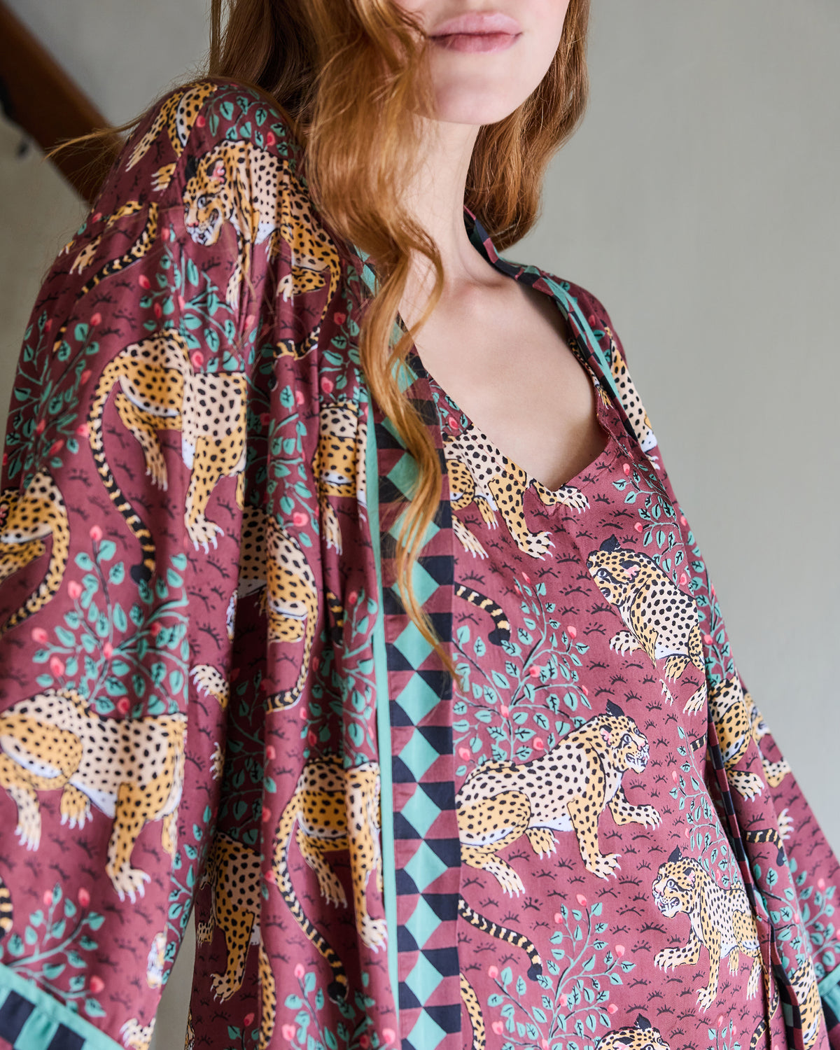 Close-up of the Bagheera Eco Satin Nightgown neckline and leopard print with patterned robe trim.