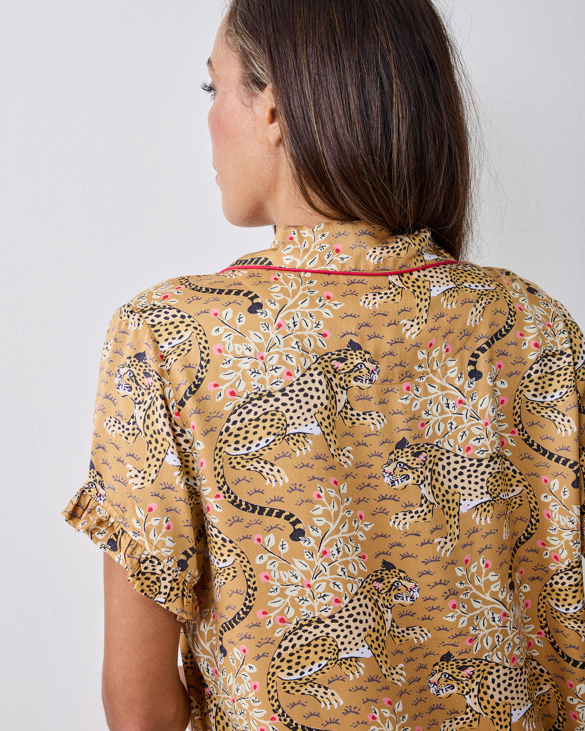 Close-up back view of the tobacco Bagheera leopard-print pajama top with ruffled sleeve trim.