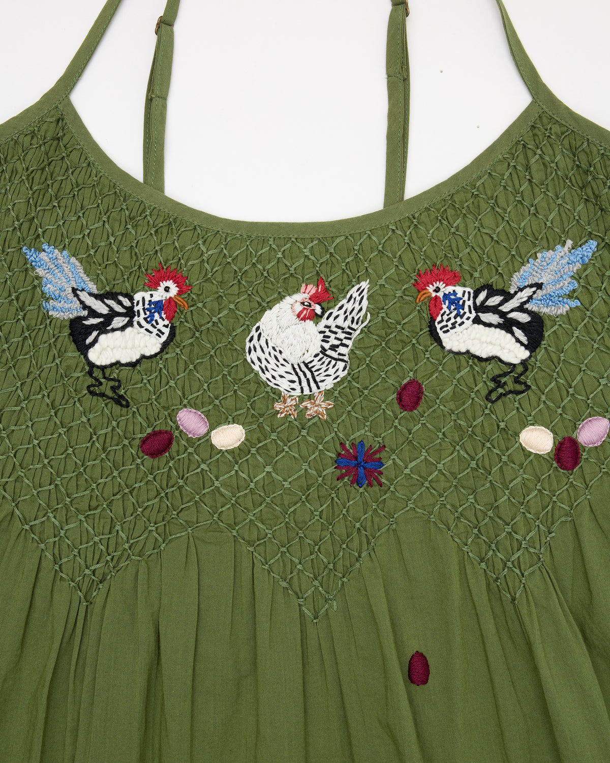 Close-up of the olive Chickens & Roosters nightie showing embroidered chickens and textured stitching