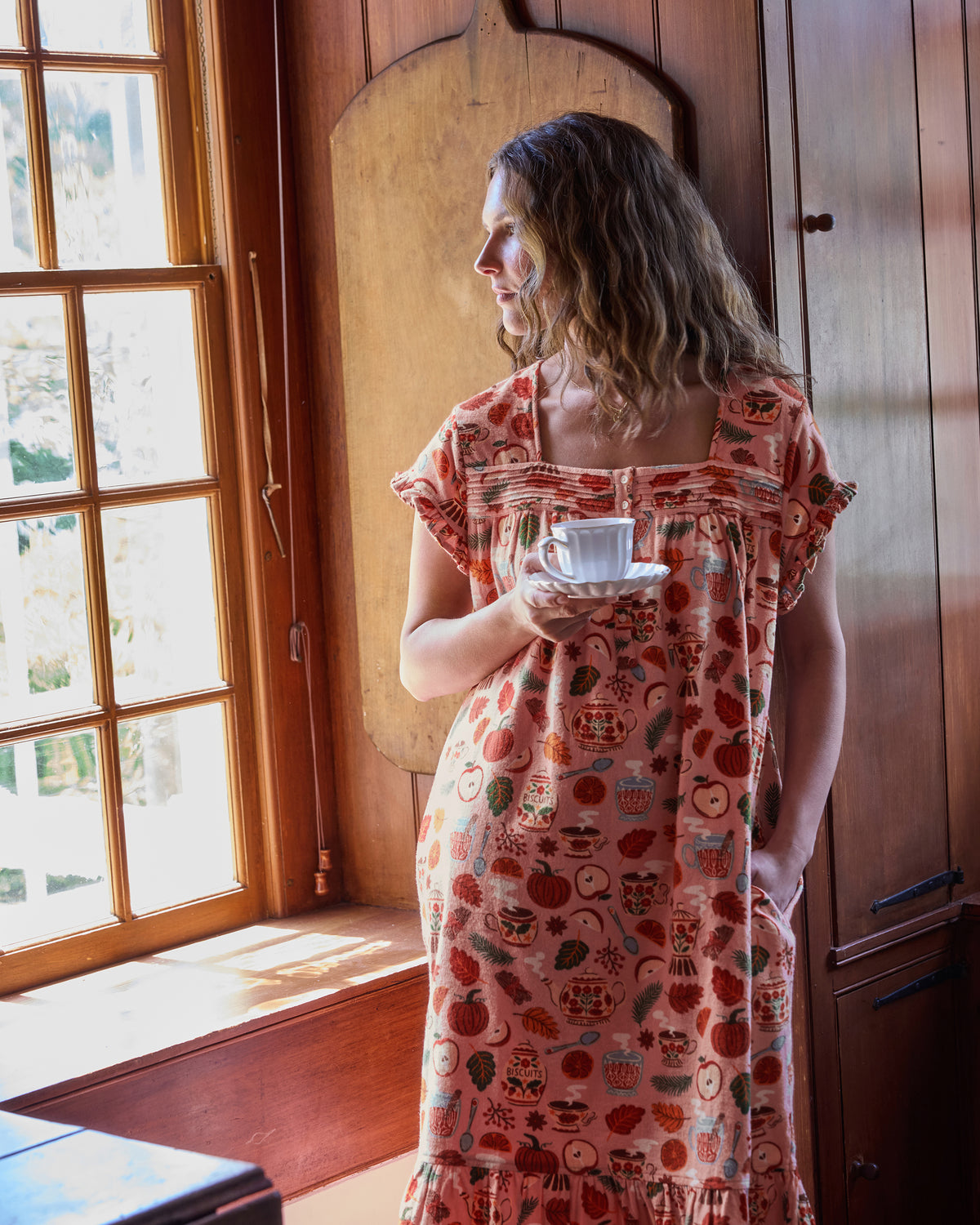Back view of the Autumn Cafe nightgown showing the gathered square back neckline, short sleeves, and ruffled hem.