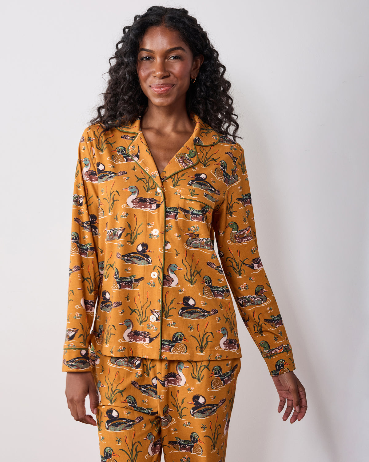 Front view of the mustard Duck Pond long pajama set showing the button-down top, chest pocket, long sleeves, and full-length pants.