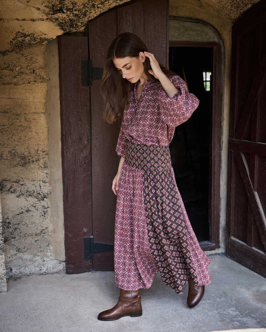 Angled view of the patterned Coraline skirt, showing its full length and contrasting panel design.