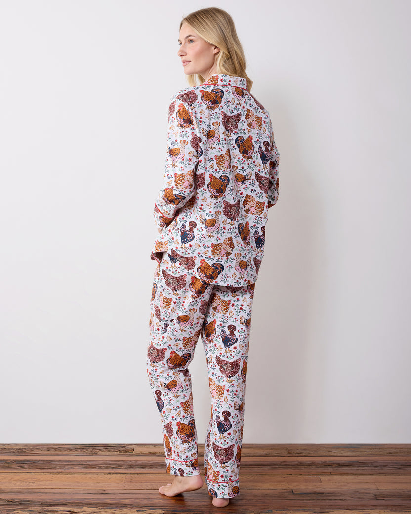 Back view of a long chicken-print pajama set with a collared top and long pants.
