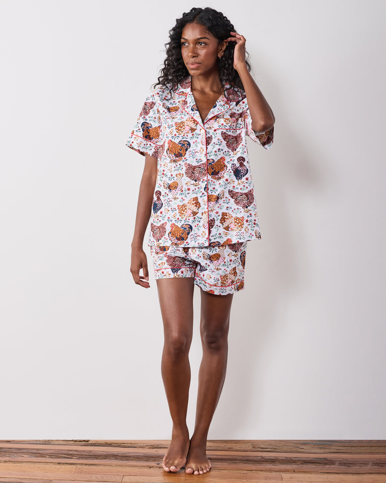 Full-length front view of a short chicken-print pajama set with a collared short-sleeve top and shorts.