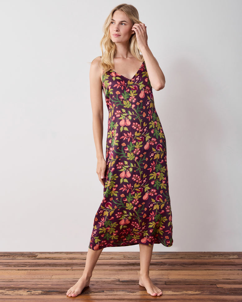 Full-length front view of a person wearing a plum floral-print sleeveless nightie