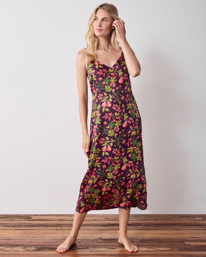 Full-length front view of a person wearing a plum floral-print sleeveless nightie