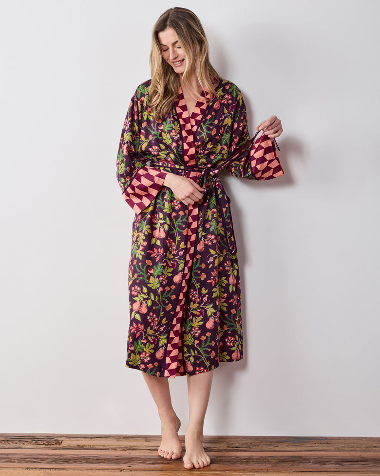 Full-length front view of the plum Pomme & Poire robe with a tied belt, long sleeves, pockets, and contrasting geometric trim.