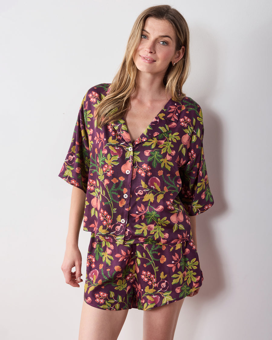 Closer front view of the plum Pomme & Poire Sweet Dreams short pajama set with a V-neck button-front top and matching shorts.