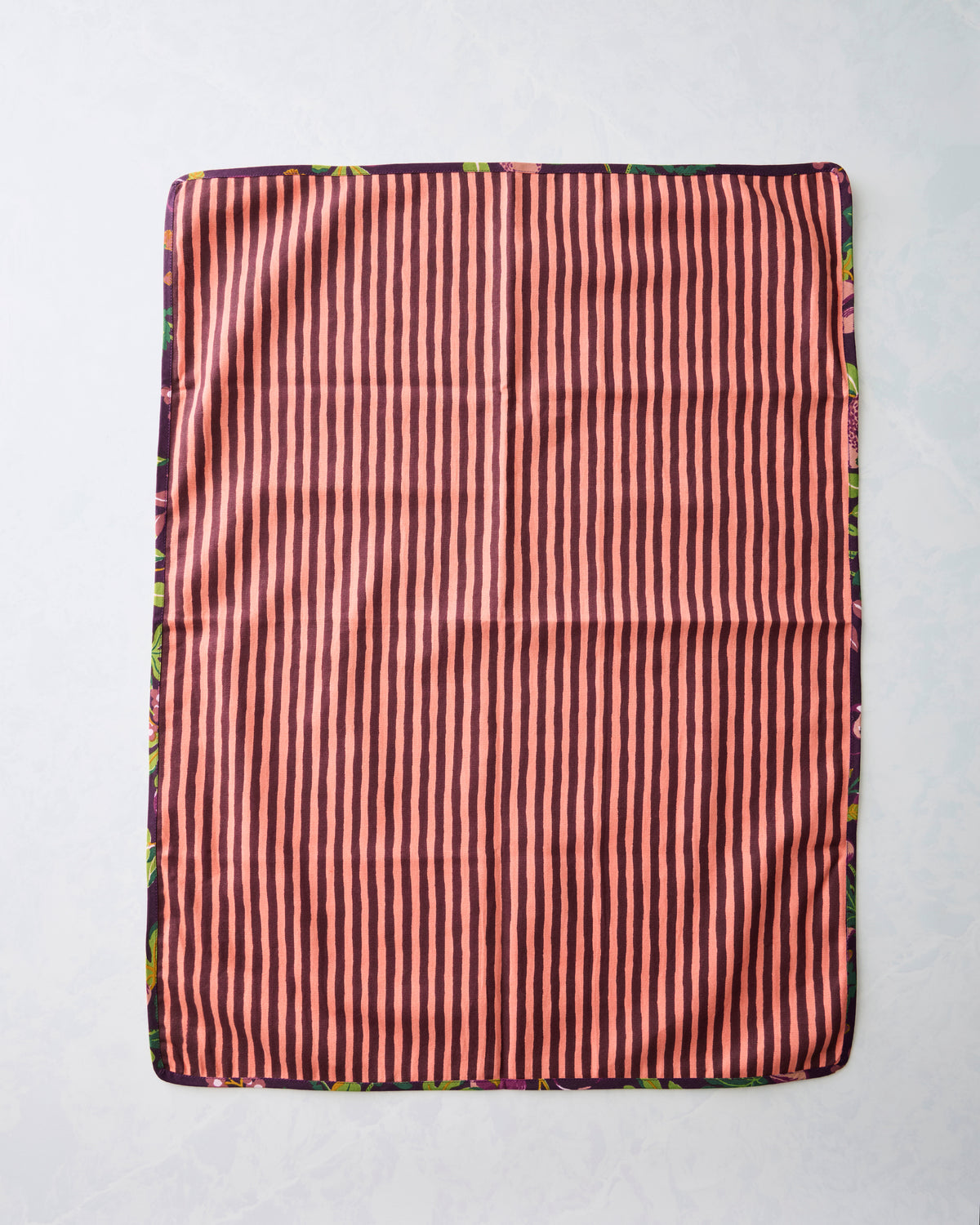 Reverse side of the Pomme & Poire plum tea towel set, showing pink and dark vertical stripes.