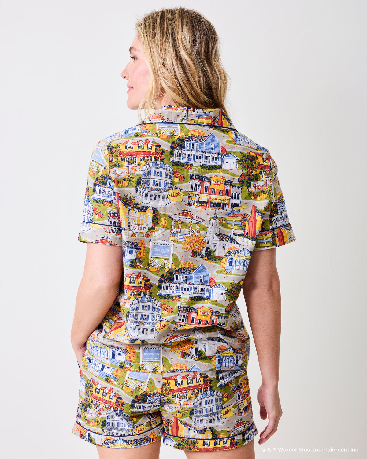 Back view of a model wearing the Stars Hollow printed short-sleeve pajama top and matching shorts.