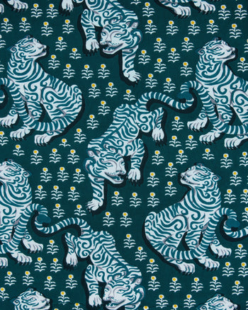 Fabric-pattern swatch showing white and blue illustrated tigers on a dark teal background with small white flowers.