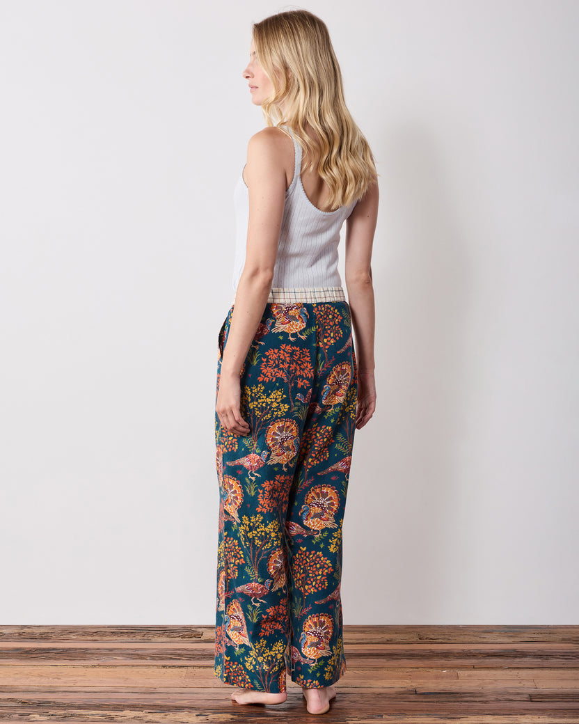 Back view of the navy Turkey Trot wide-leg pajama pants showing the rear fit and turkey and foliage print.