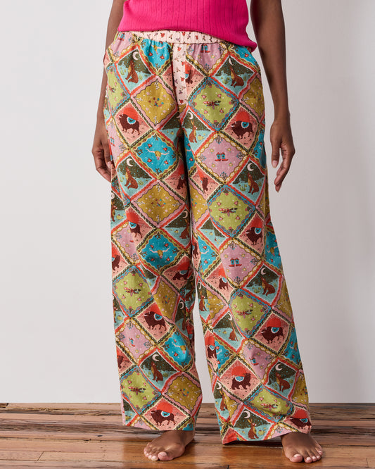 Front close-up of the Western Scenes wide-leg pajama pants, showing the elasticized waistband and patchwork print.