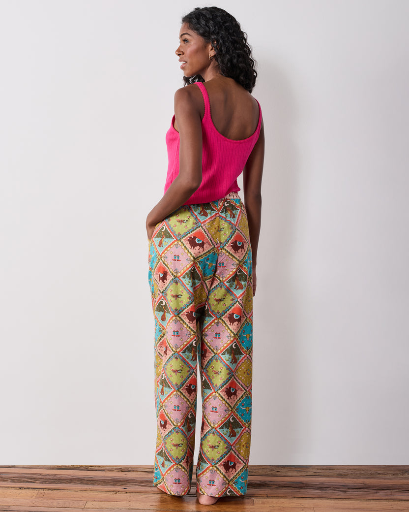 Back view of the Western Scenes wide-leg pajama pants worn with a pink tank top, showing the full-length relaxed silhouette.