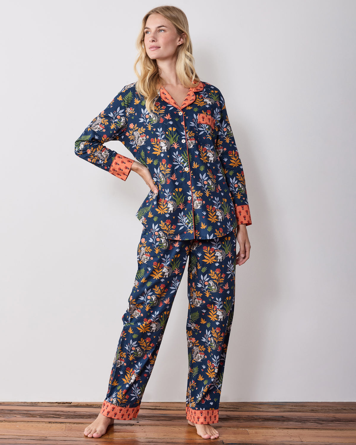 Full-length front studio view of the Woodland Critters tall indigo long pajama set with a button-front top and matching pants.