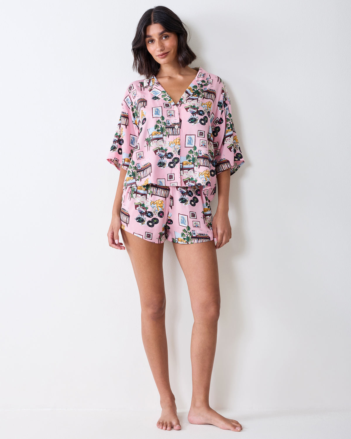 Full-length front view of the pink printed Eco Satin Sweet Dreams pajama set with a cropped button-front top and shorts.