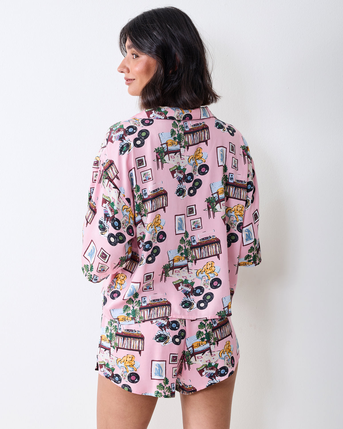Back view of the pink printed Eco Satin Sweet Dreams pajama set, showing the rear of the button-front top and matching shorts.