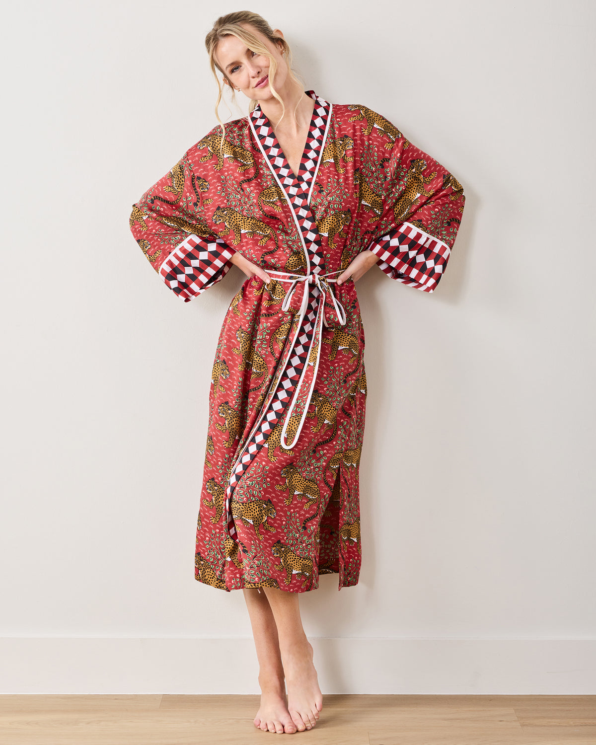Front view of the Scarlet Bagheera leopard-print robe showing the contrasting trim, wide sleeves, and tied waist.