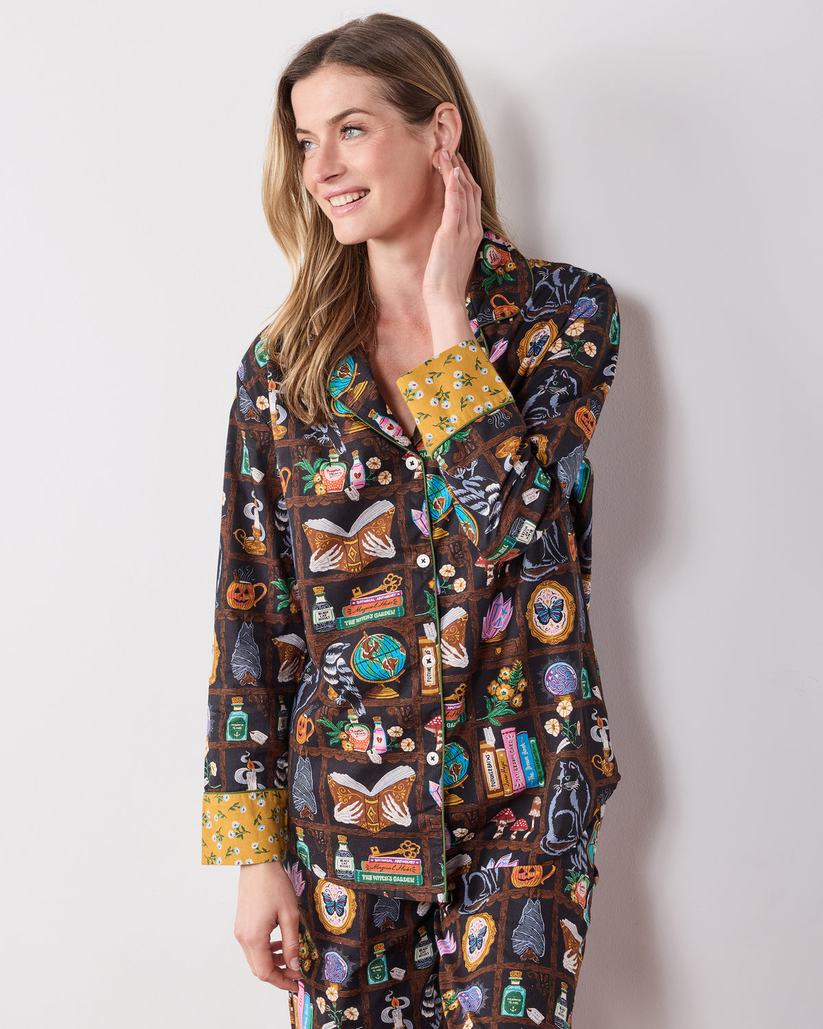 Front view of the Enchanted Study petite long pajama set showing the collared button-down top and full-length printed pants.