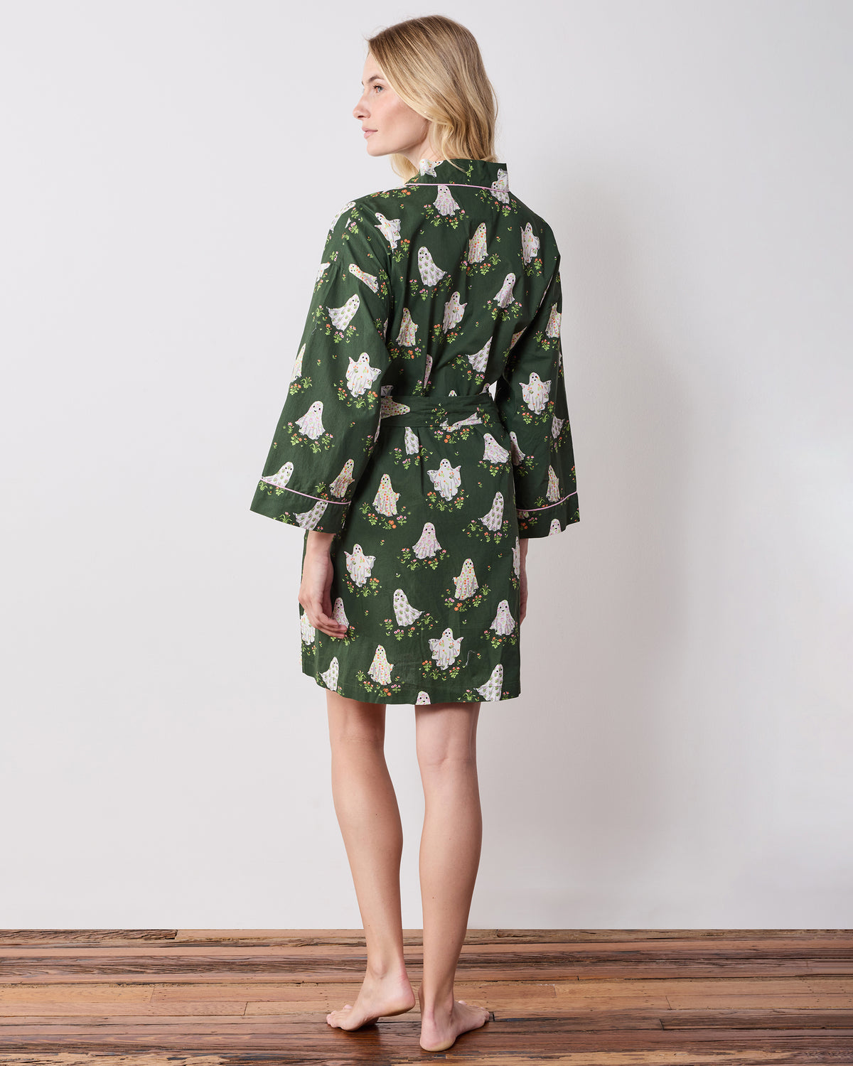 Back view of the Gardening Ghosts short robe with a tied belt, long sleeves, and ghost-and-flower print.
