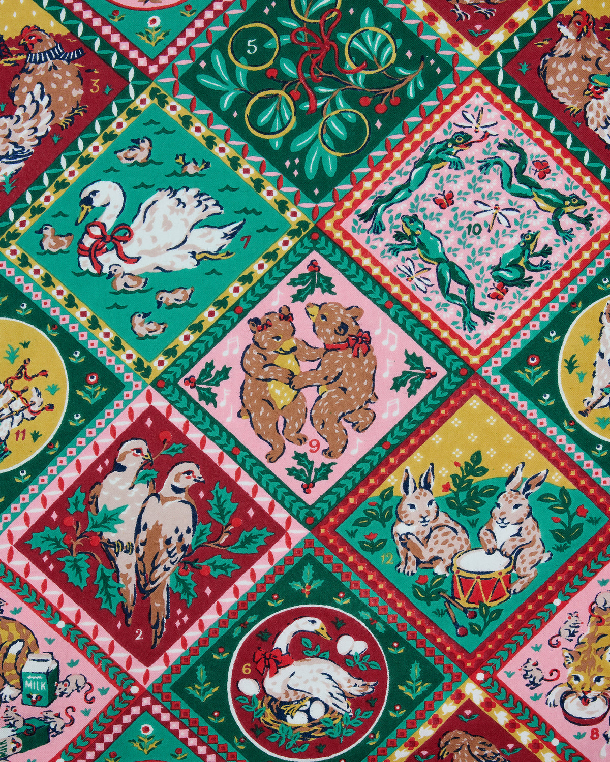 Close-up of the 12 Days of Christmas print showing framed illustrations of animals, plants, ornaments, and holiday scenes.