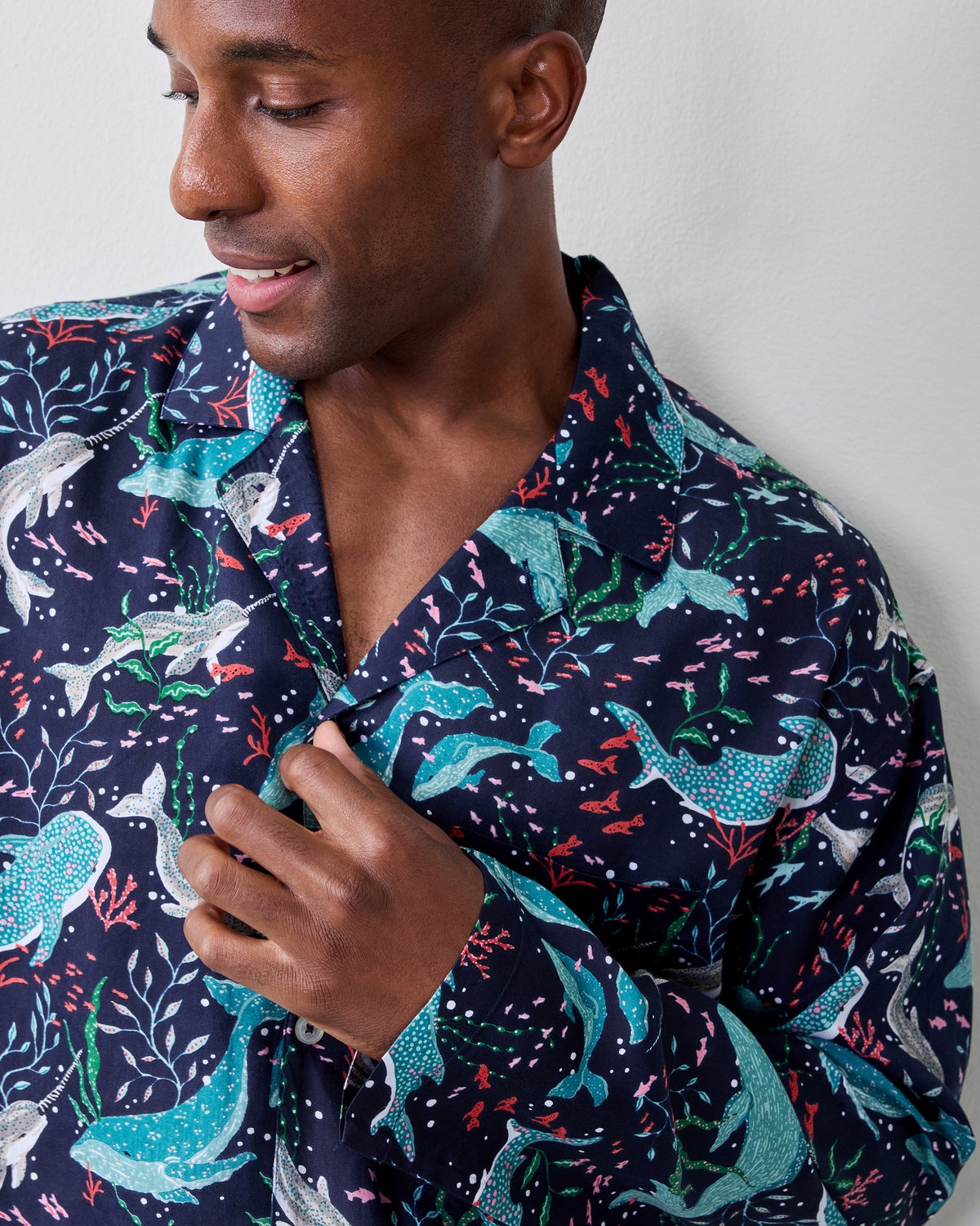 Close-up of the Blue Chill Arctic Sea Life pajama shirt showing its open collar, buttons, and colorful aquatic print on a navy background.