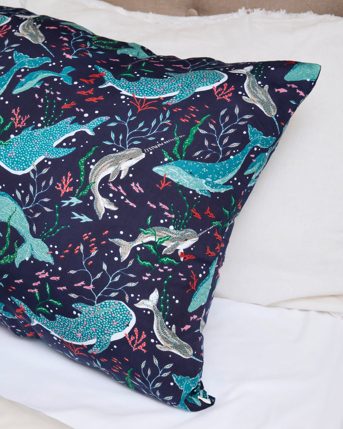 Blue Chill Arctic Sealife pillowcase with whales, seals, coral, and sea plants on a white bed