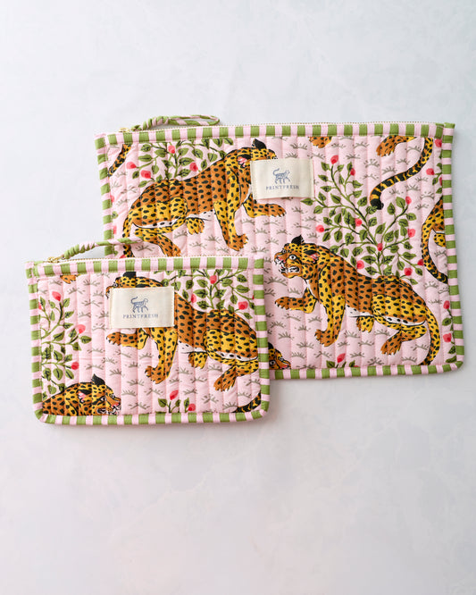 Two pink quilted zippered pouches with green trim, leopard and leafy floral print, and Printfresh labels.