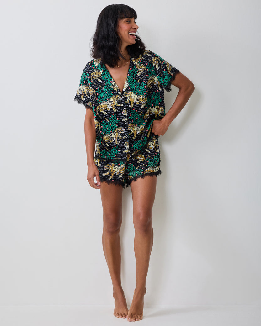 Full-length view of the Bagheera Eco Satin Maryanne Set in Ink, showing the short-sleeve button-front top and matching lace-trimmed shorts.