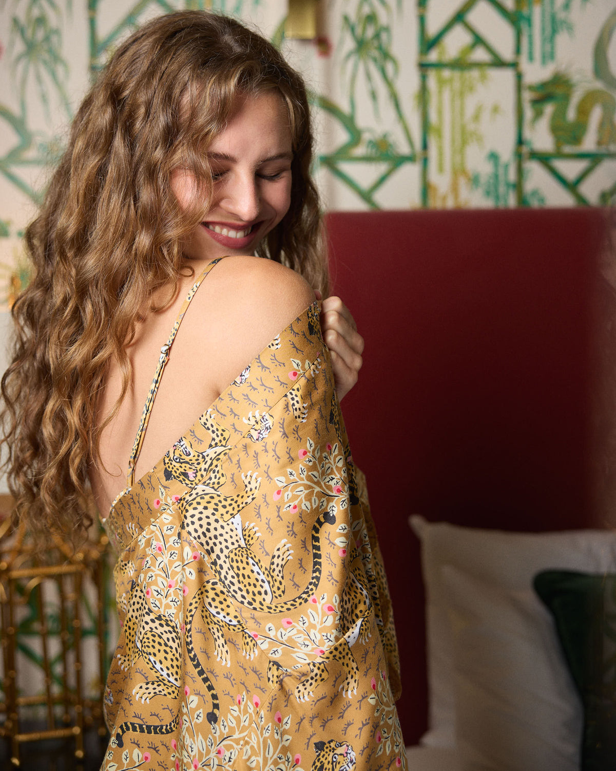 Bagheera tobacco lace robe shown from the back with one shoulder exposed, highlighting the leopard-and-floral print.