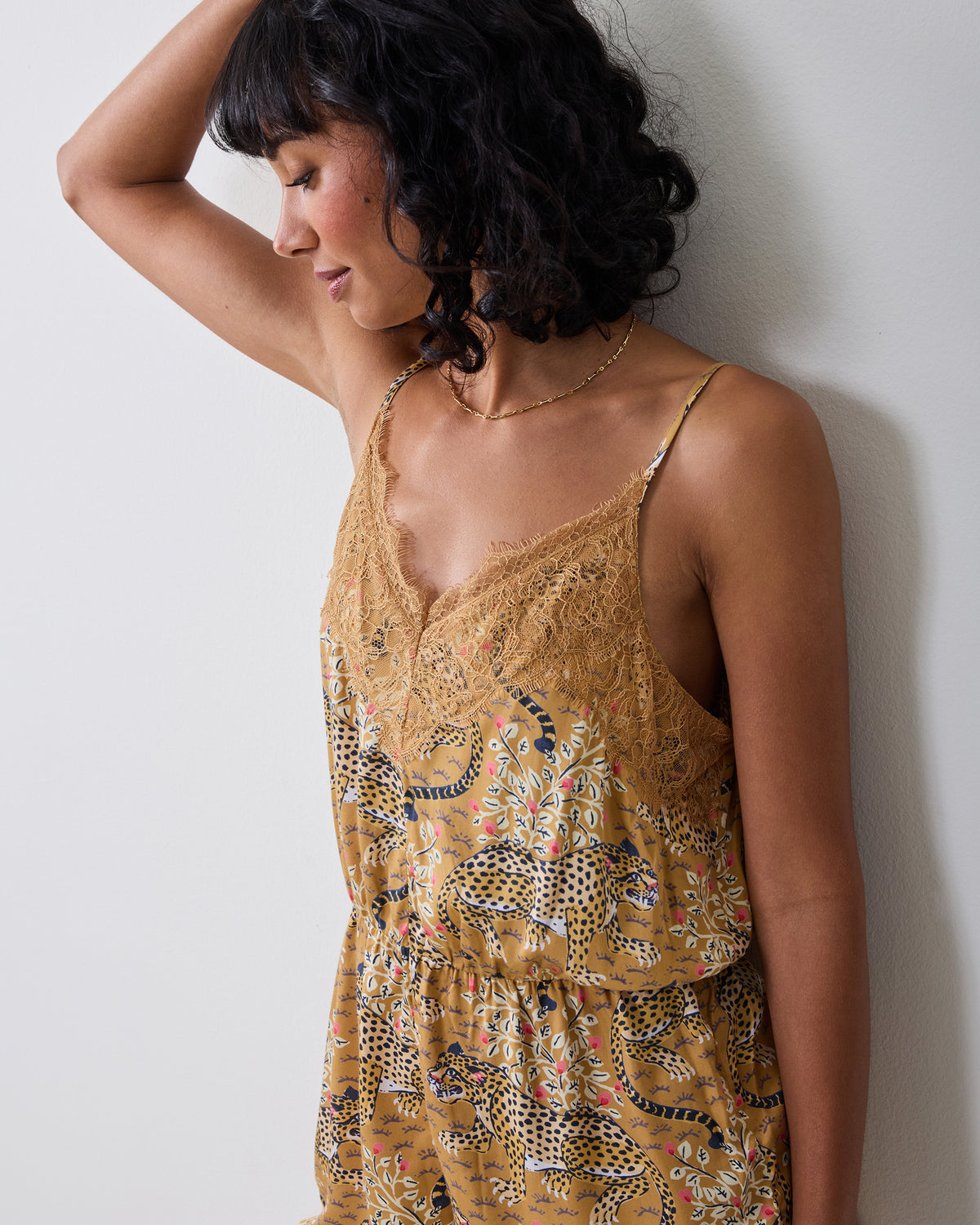 Bagheera Tobacco leopard-print Madeline romper with lace trim and thin shoulder straps, shown from the front.