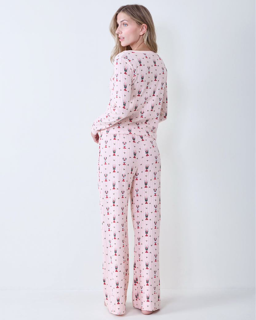 Back view of the Christmas Claws Kaylee pajama set with matching printed long-sleeve top and pants.